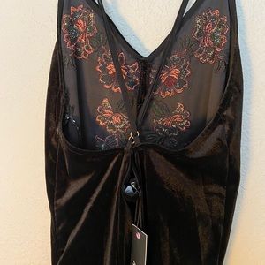 A black and embroidered dress
